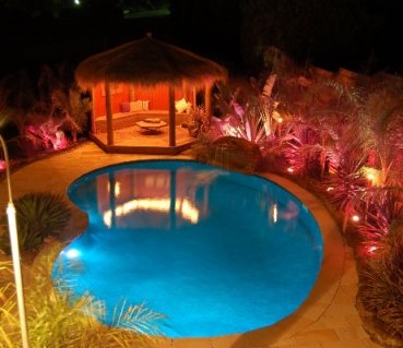 kidney-shaped-inground-melbourne-swimming-pool-at-night-with-lights