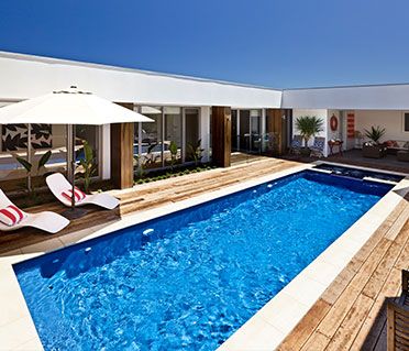 Swimming Pool Design 21 attractive wooden deck mesmerizing design swimming pool Family Swimming Pools Swimming Pool Design swimming pool designs with waterfalls ideas including images Family Swimming Pools